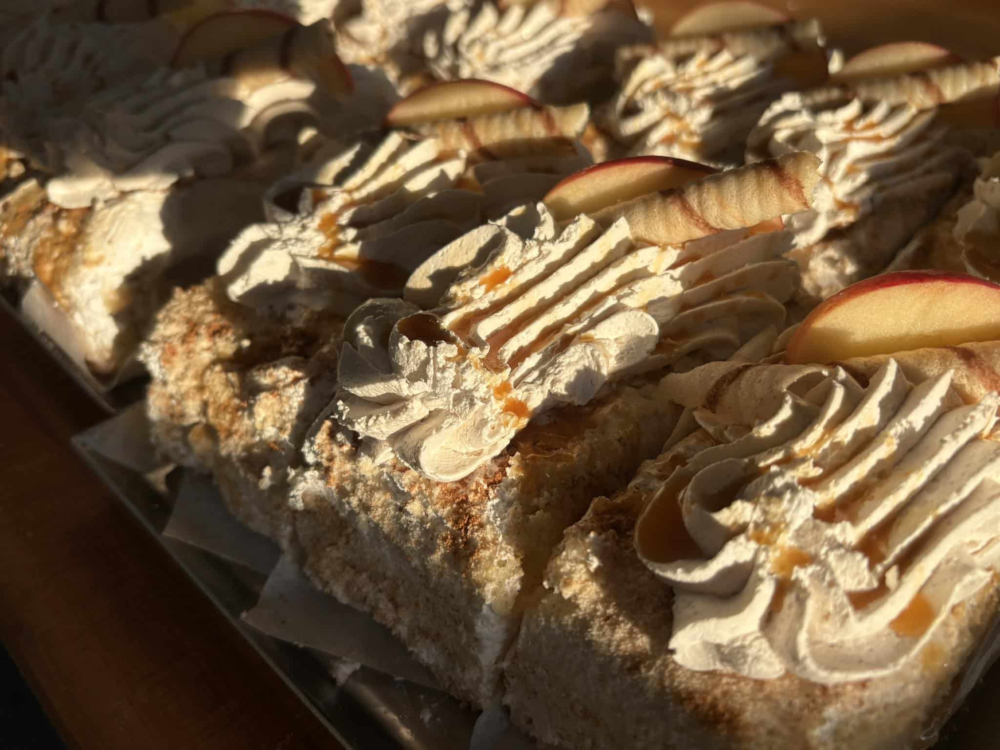 Close-up of pastries topped with white icing drizzle at Bagel Chicks Bakery.