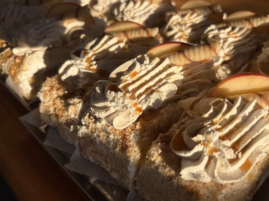 Cream-topped pastries with apple slices from the story of The Sicilian Who Taught West Virginia to Love Bagels.