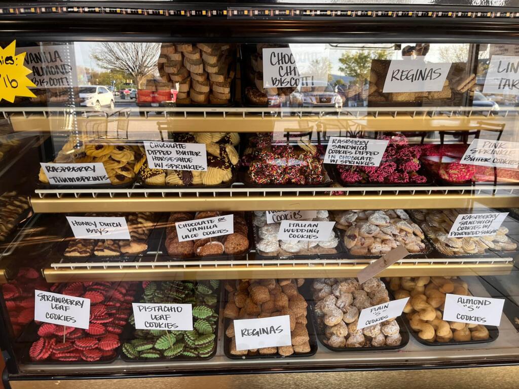 Bakery case with Italian cookies, butter cookies, thumbprints, and assorted sweets showing the variety behind Mid-Atlantic breakfast culture.