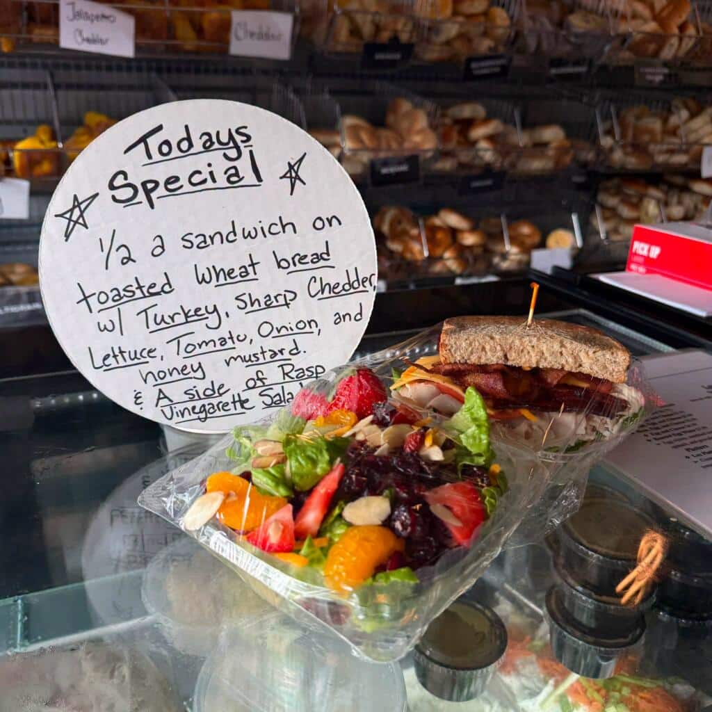 Loaded turkey sandwich and fresh salad served instead of a drive-thru meal.